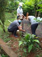 Volunteers and families working on reg agriculture