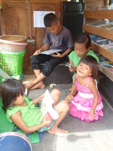 Children reading books in the Mobile Library
