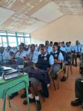 A picture of high school learners in a classroom.