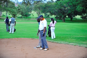 A blind golf player with his guide.