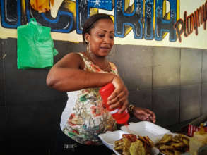Local woman managing a food stand