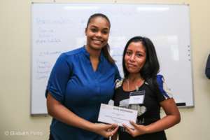 The Executive Director providing scholarships