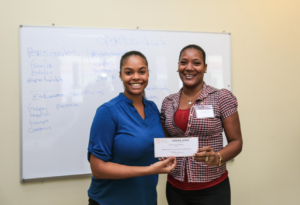 Receiving her scholarship.