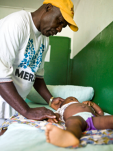 Mabelle's son is treated in Zleh health clinic