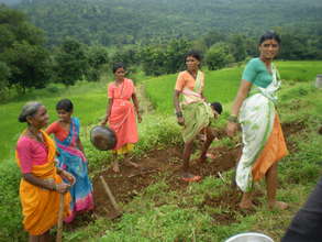 women constructing a water supply scheme