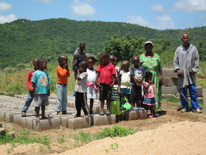 Students with building blocks for the new toilet.
