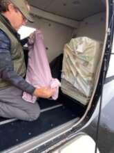 Securing the bird cages in the plane