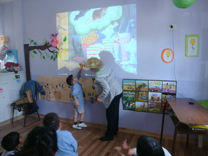 Celita interacts with a little deaf child