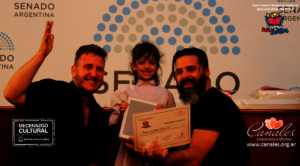 The youngest winner receives her tablet