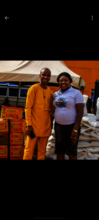 Volunteers prepare and distribute food packs and s