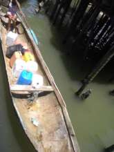 Transporting water into Buenaventura by canoe