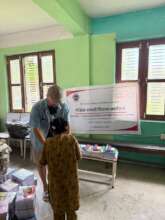 student receiving the material from Binod