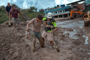 Nepal Flood Survivors Search Through the Mud