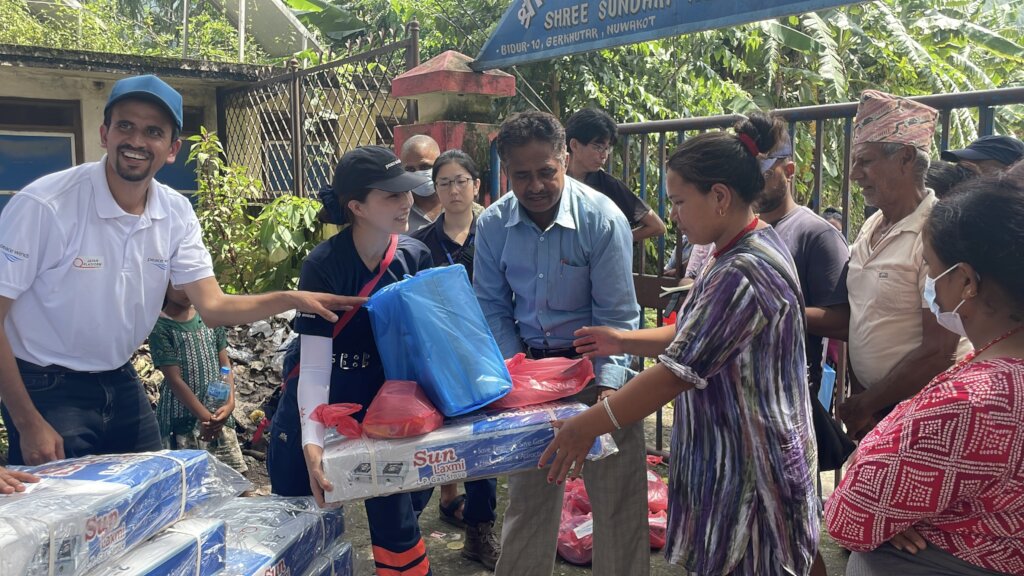 Peace Winds team distributes kitchen supplies