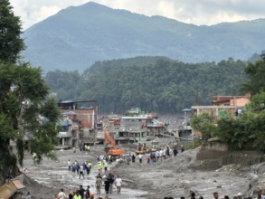 Survivors, aid workers, flood damage in Nepal