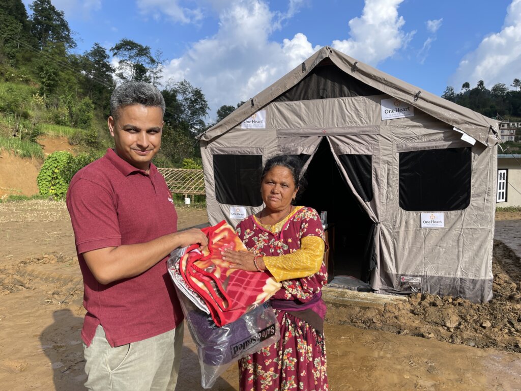 Delivering warm supplies to a displaced woman