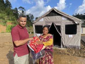 Delivering warm supplies to a displaced woman
