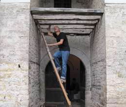 Volunteer records condition under the arched entry