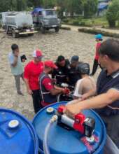 FRF Team handing out fuel in Trishuli
