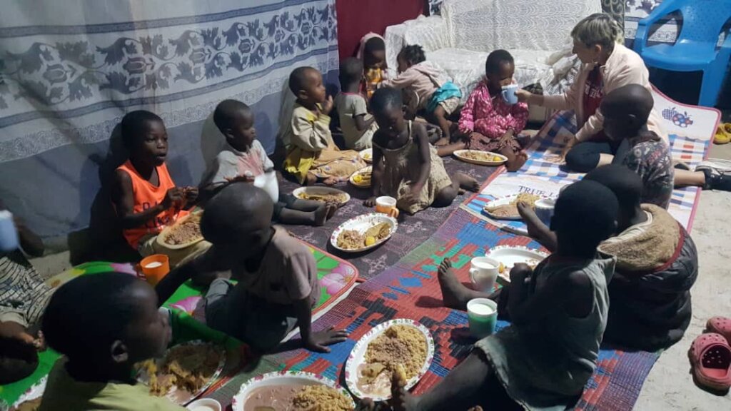 Our children enjoying the meal at the Home