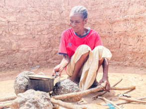 Displaced woman Mrs. Shinku Ukusuyol prepares meal
