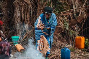 Aisha and her displaced friend prepare local food