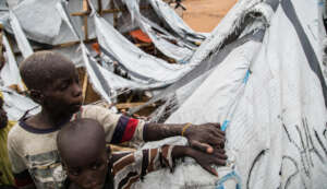 Two Children Beside Their Temporary Shelter Destro