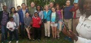 Kae Dakins with family and THAP patients