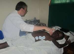 Doctor examines patient