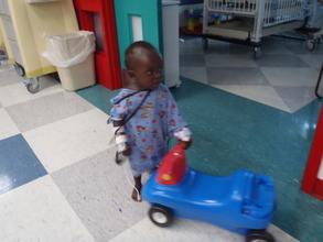 Luke taking his first steps in the hospital