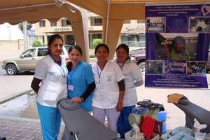 Dr. Apata in blue with Dental Hygienists