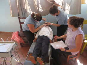 Katie Fleming with Amber and Lisa in jungle clinic