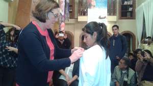 Rosie Bellert RDH BS bestowing award at school