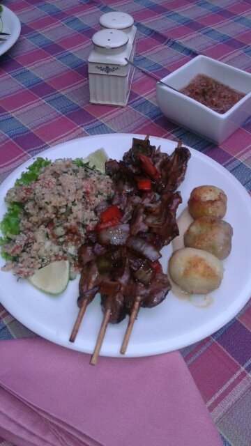 Dish of quinoa, barbecued heart & peanut potatoes
