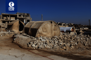 Families Living in Tents Among the Rubble