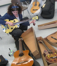 Alisa Peres tunes teachers' guitars in San Jose