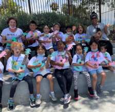 Joyful K-2 Students in a Summer Strummers Club