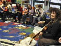 Teachers strum & sing at GITC-Lee, MA