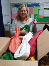 Kim Smith receives ukuleles at Dewey Elementary