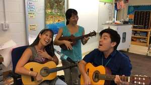 Teachers practice water songs at Pomaikai