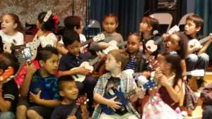 Kindergarteners strum, sing and learn!