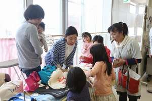 Women sell their handmade goods