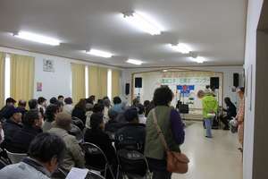 A concert is held at the new community house.