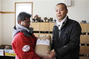 AAR JAPAN member delivering locally produced rice
