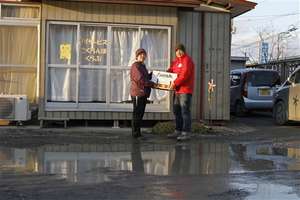 Land liquefaction left puddles around the building