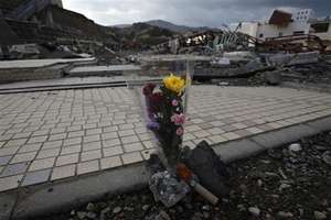 A bouquet of flowers left to the devastated city