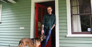 Pete, outside his home after repairs