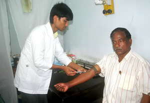 A Pathology Paramedic Drawing Blood of Patient