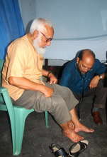 Doctor Examining the Feet of a Patient