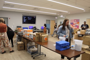 Staff assembling move-in kits for new residents